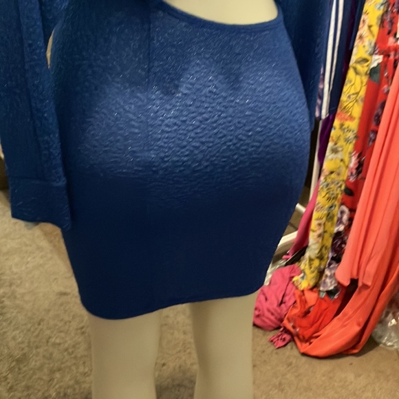 This is a navy blue long-sleeved dress with a cutout at the waist. - Picture 5 of 5